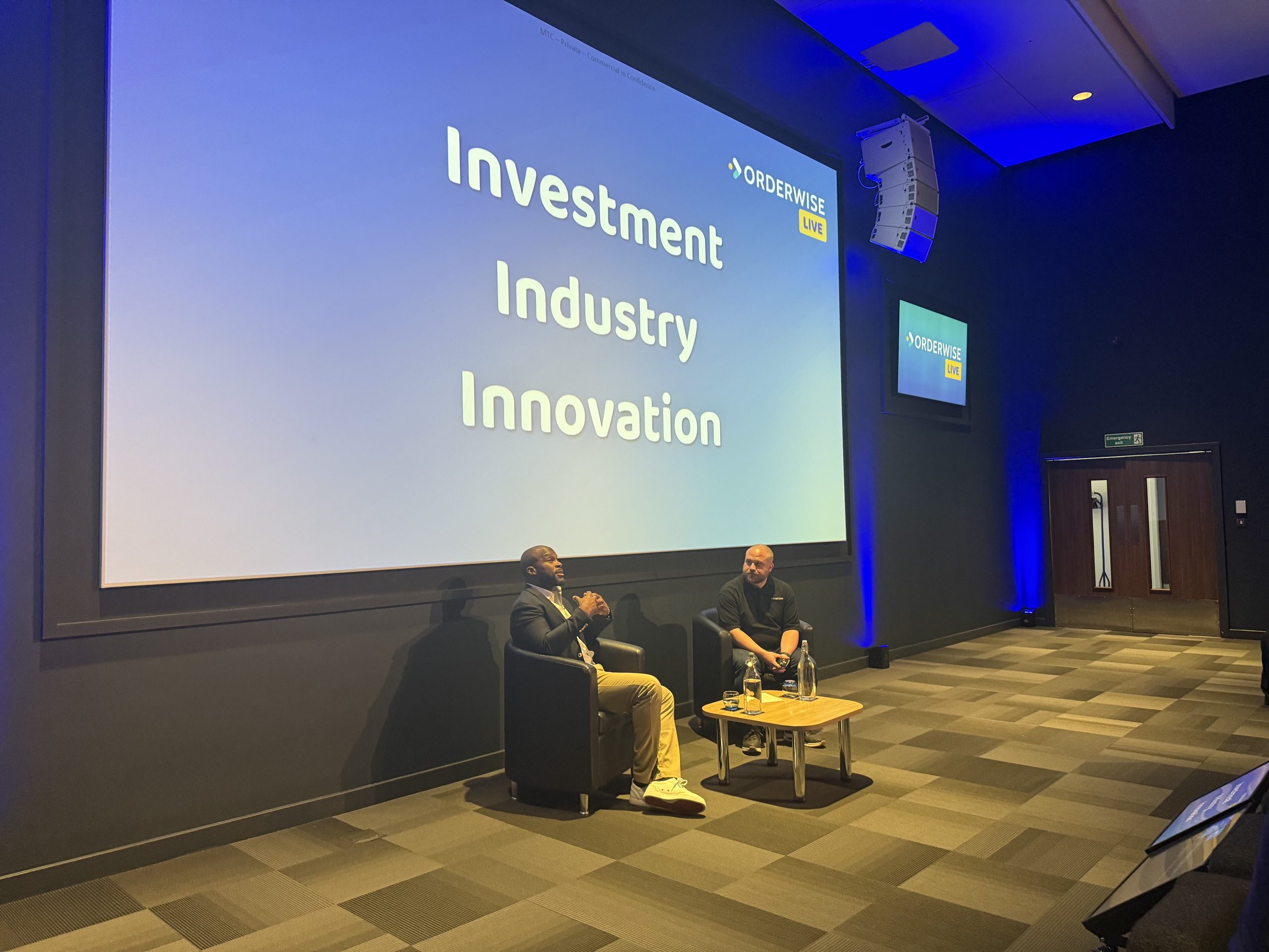 Orderwise Live event: investment, industry, innovation discussion with two engaged speakers.